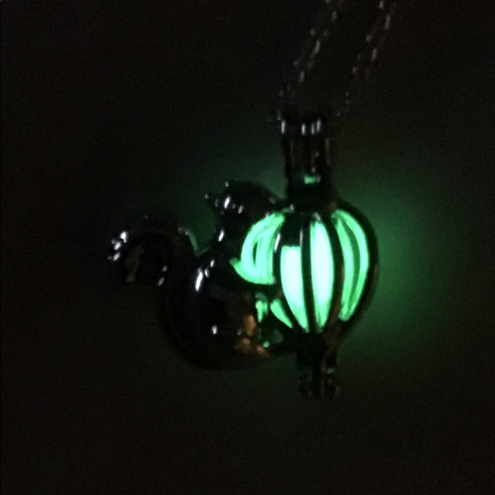Squirrel with green luminous glow nut necklace